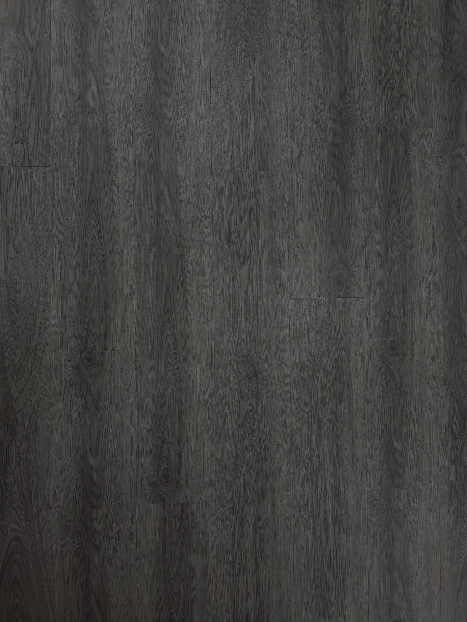 Bracken Ash LVT Plank – close-up photograph of the dark grey wood-effect plank surface