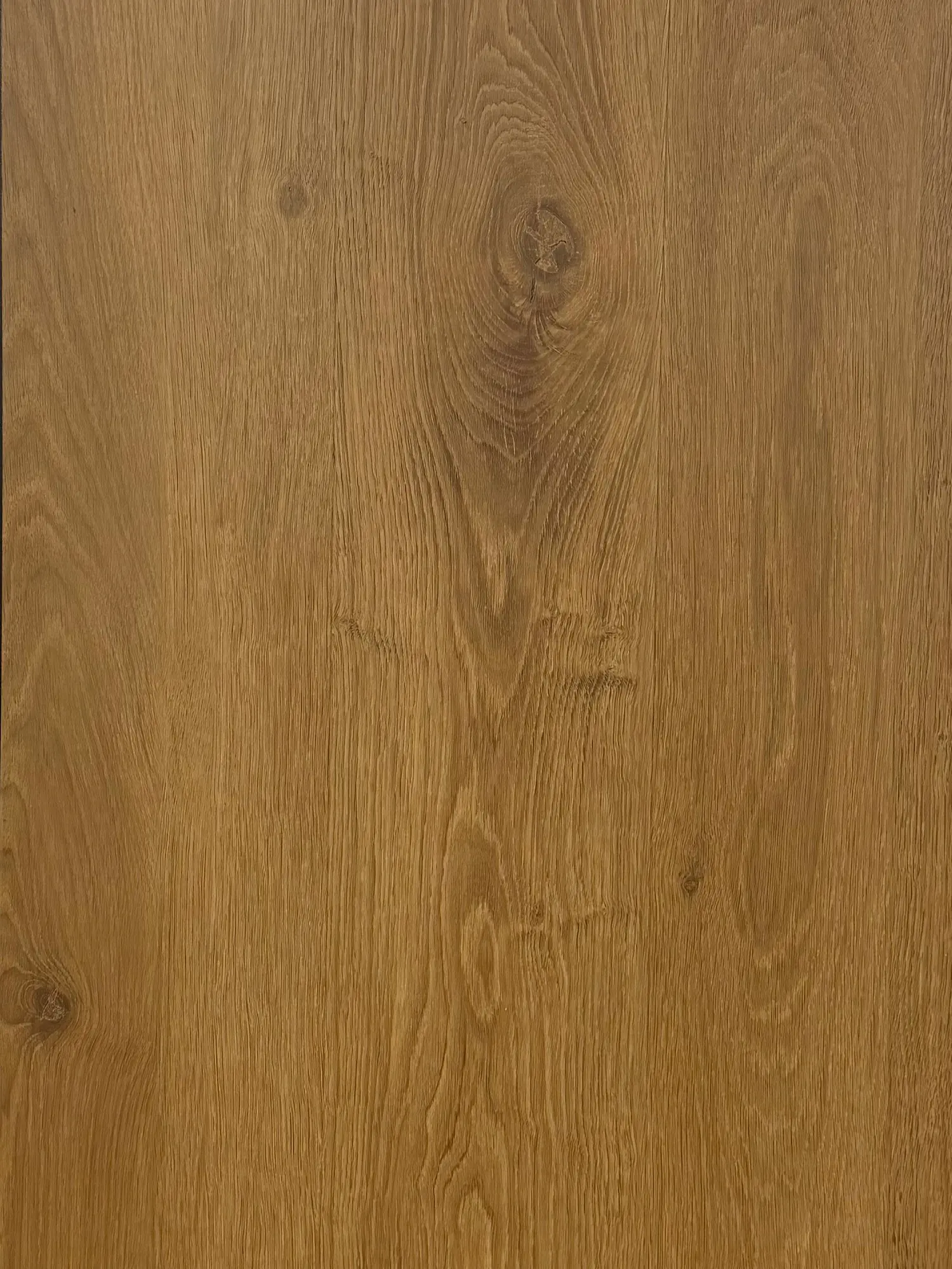 English Oak flooring – close-up photograph of the warm oak-effect plank surface