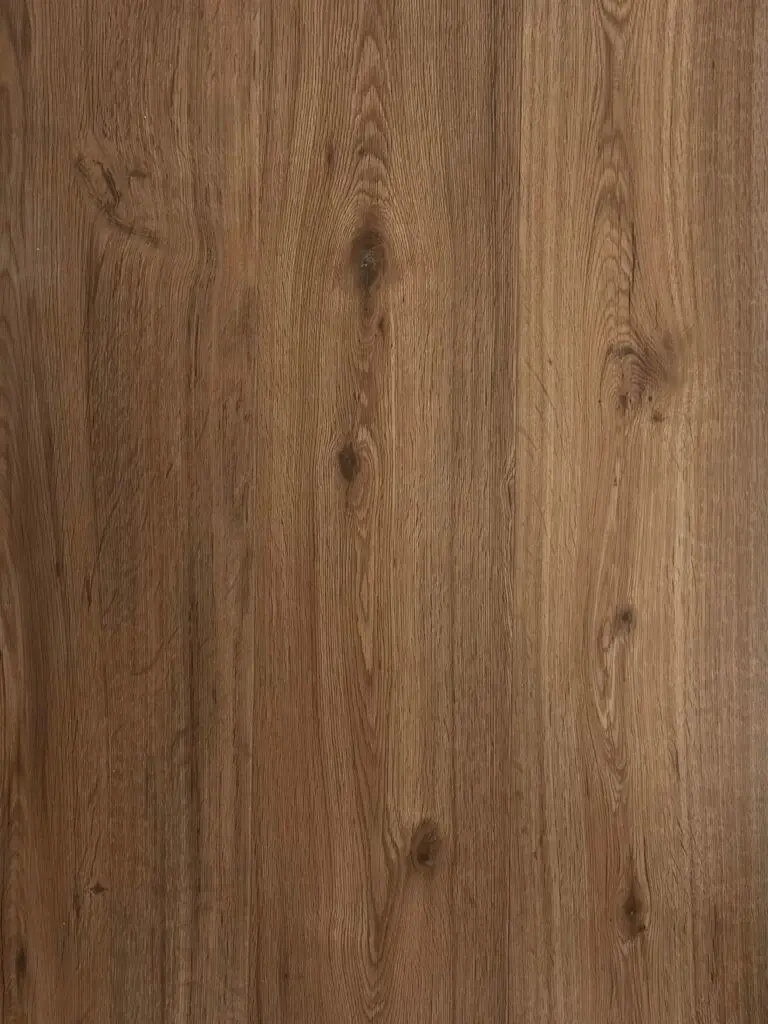 Espresso LVT plank flooring – photograph of the actual product showing its warm mid-brown oak grain and knots