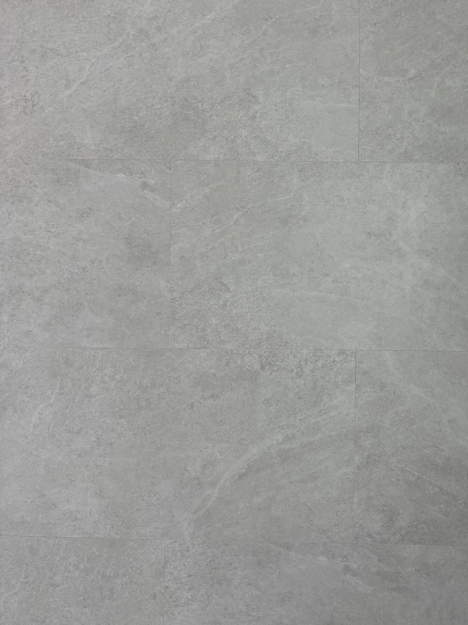 Silver Moon SPC Click – close-up photograph of the light grey stone-effect tile surface