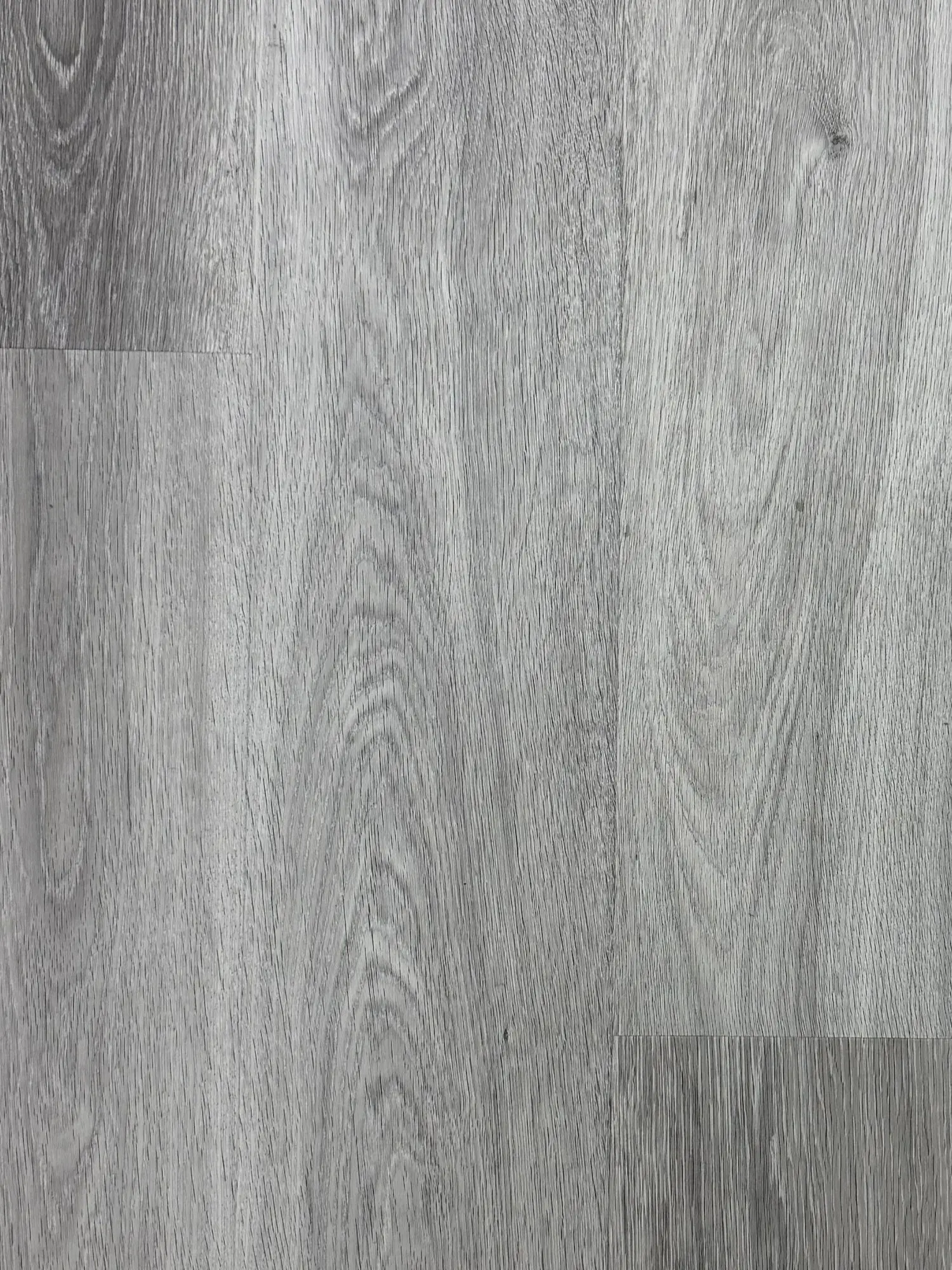 Urban Charcoal LVT Plank – close-up photograph of the grey oak-effect planks